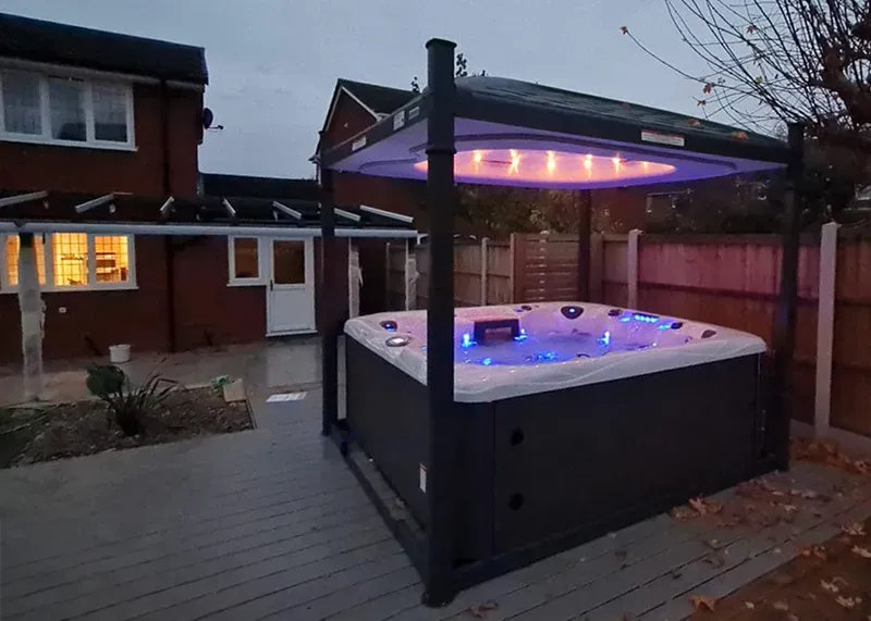 Hot tub lit up at night