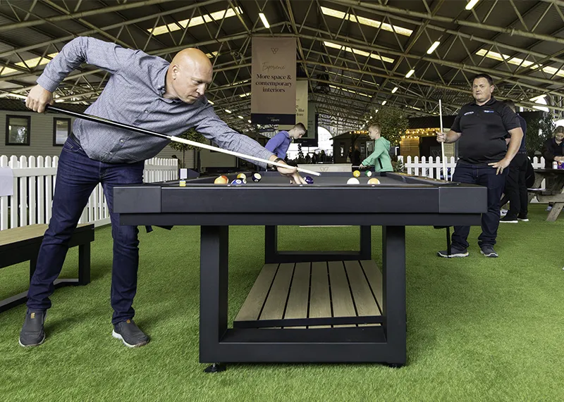 Playing on a Lanai 8′ Outdoor Pool Table