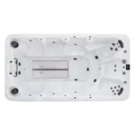 Top down view of American Whirlpool RB swim spa showing the swim zone, and seating options with 3 massage seats at one end and benches down each side with jets. In a silver marble coloured shell.