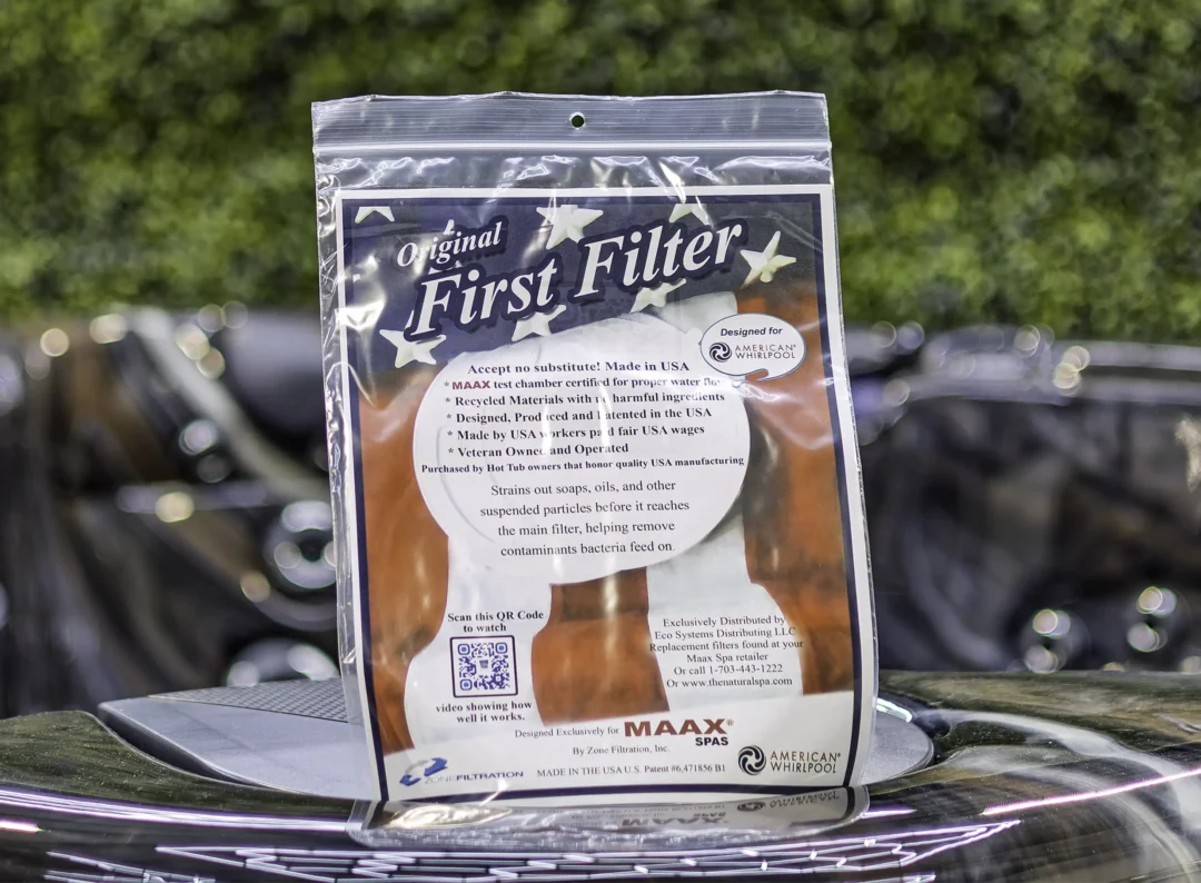 American Whilpool First Filter product photo showing the front of the outer packaging, sat on top of an American Whirlpool hot tub.