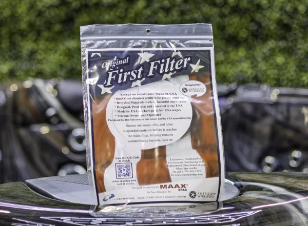 American Whilpool First Filter product photo showing the front of the outer packaging, sat on top of an American Whirlpool hot tub.