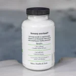The right of a 19oz tub of Spazazz naked therapy hot tub aromatherapy crystals on the edge of a hot tub