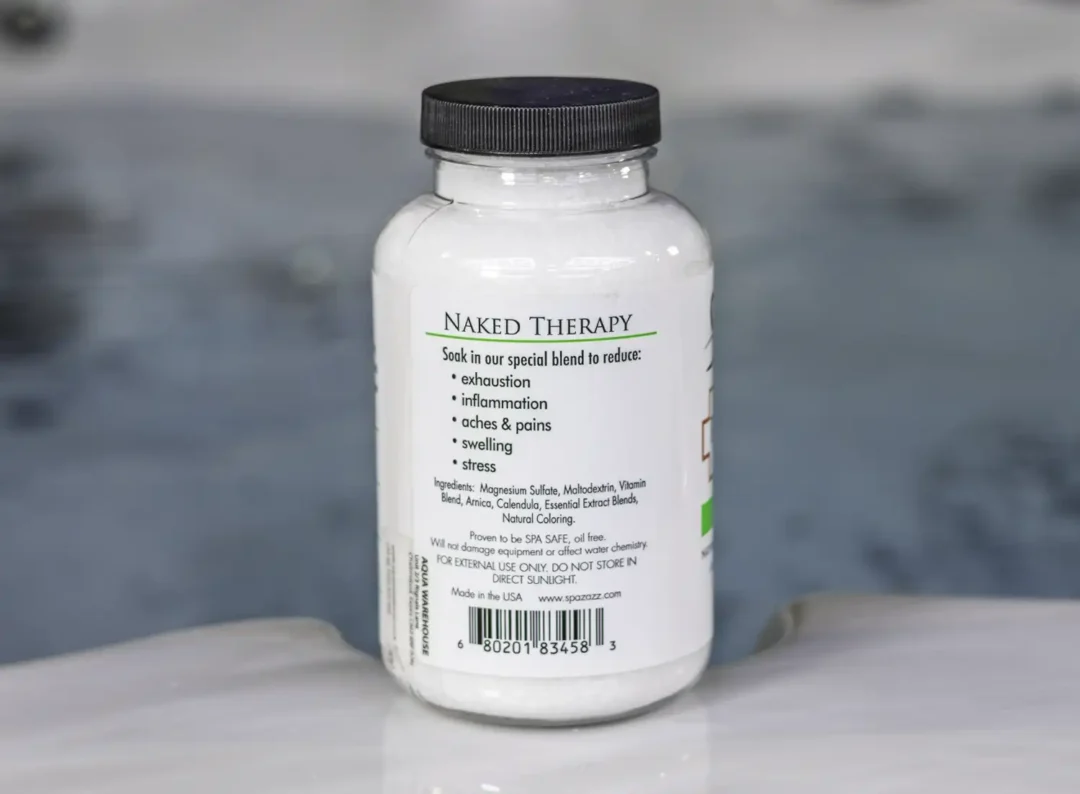 The right of a 19oz tub of Spazazz naked therapy hot tub aromatherapy crystals on the edge of a hot tub