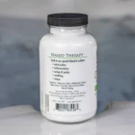 The right of a 19oz tub of Spazazz naked therapy hot tub aromatherapy crystals on the edge of a hot tub