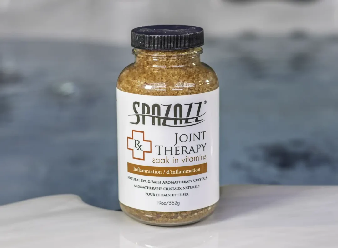 The front of a 19oz bottle of Spazazz joint Therapy on the side of a hot tub