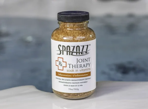 The front of a 19oz bottle of Spazazz joint Therapy on the side of a hot tub