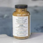 The right of a 19oz bottle of Spazazz joint Therapy on the side of a hot tub