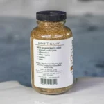The left of a 19oz bottle of Spazazz joint Therapy on the side of a hot tub