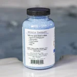 The left of a 19oz bottle of Spazazz muscle Therapy on the side of a hot tub
