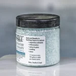 The right of a 4oz bottle of Spazazz respiratory Therapy hot tub aromatherapy crystals on the side of a hot tub