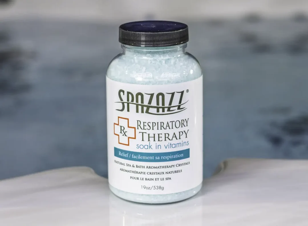 The front of a 19oz bottle of Spazazz respiratory Therapy on the side of a hot tub