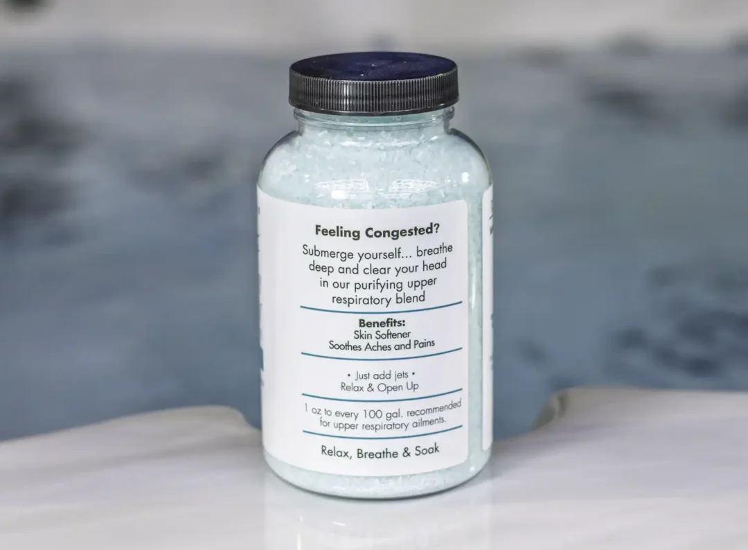 The right of a 19oz bottle of Spazazz respiratory Therapy on the side of a hot tub