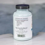The left of a 19oz bottle of Spazazz respiratory Therapy on the side of a hot tub