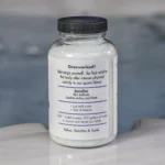 The right of a 19oz bottle of Spazazz sport Therapy hot tub aromatherapy crystals on the side of a hot tub