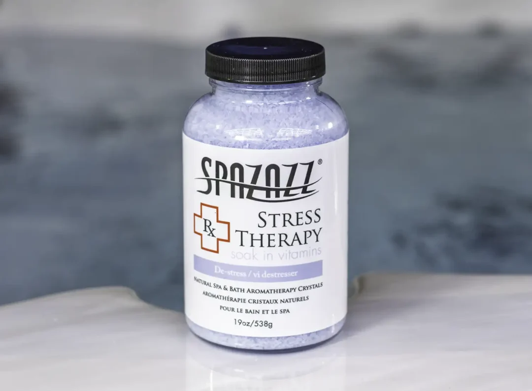 A 19oz bottle of Spazazz Stress Therapy on the side of a hot tub