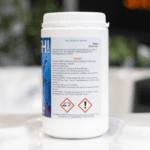 side of label for 1kg Splash Non Chlorine Shock in white plastic tub with screw top lid showing dangerous chemical information